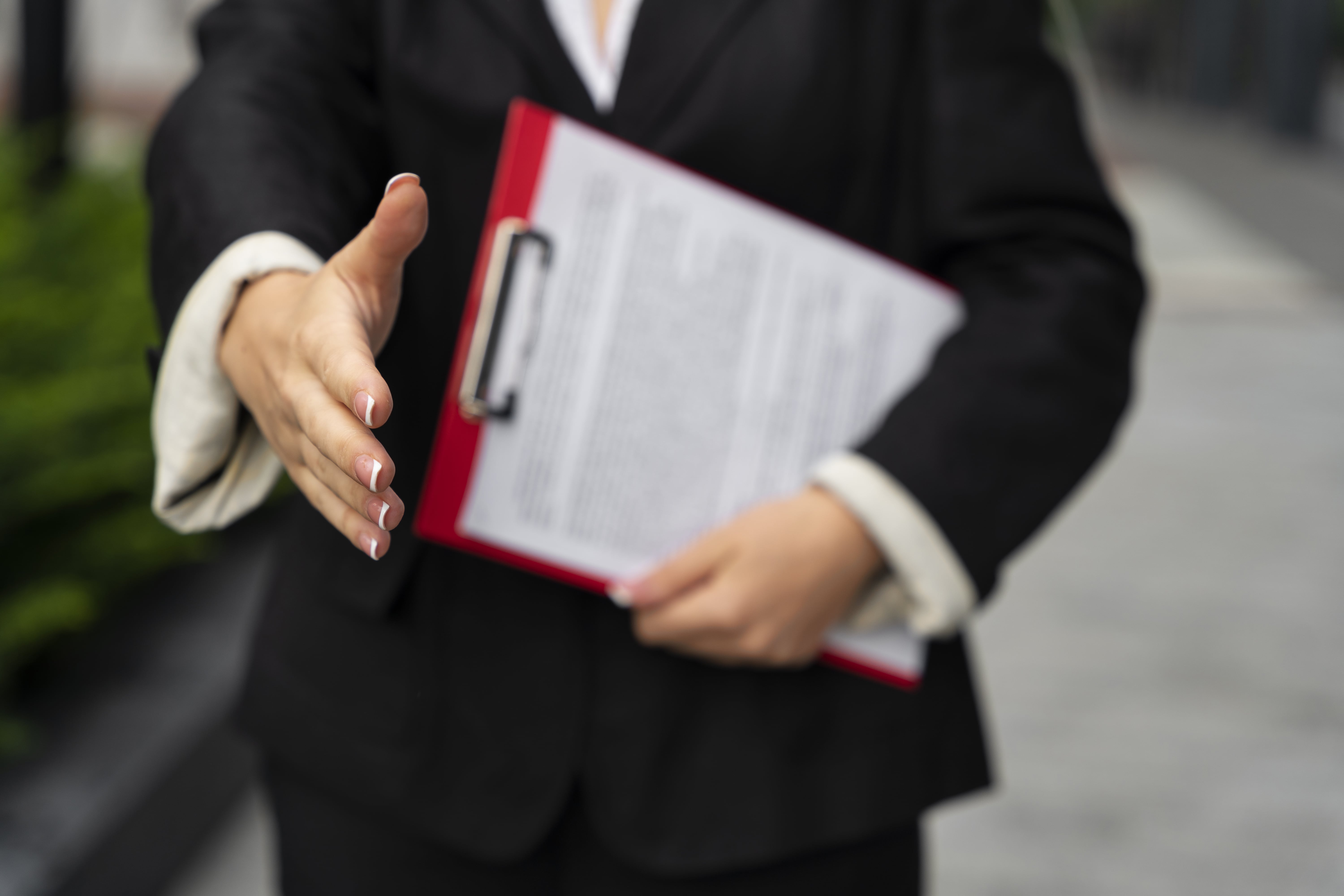 Business woman reviewing title and escrow documents